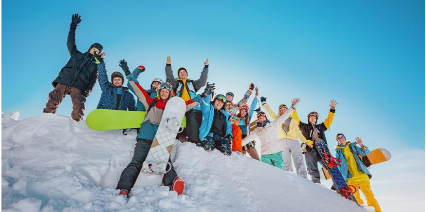 Group of snowboarders with snowboards