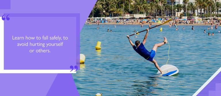 Paddleboarder falling into water with ankle leash attached