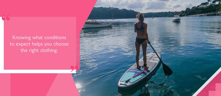 Female paddleboarder wearing bikini in summer weather