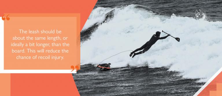 SUP paddler in surf attached to board with straight leash