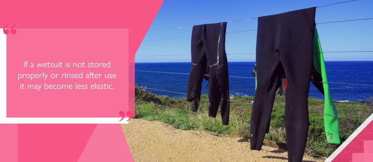 Wetsuits hanging up to dry after being rinsed