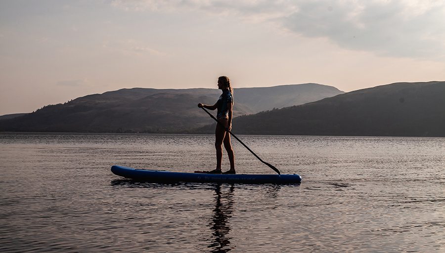 sunset stand up paddleboarding